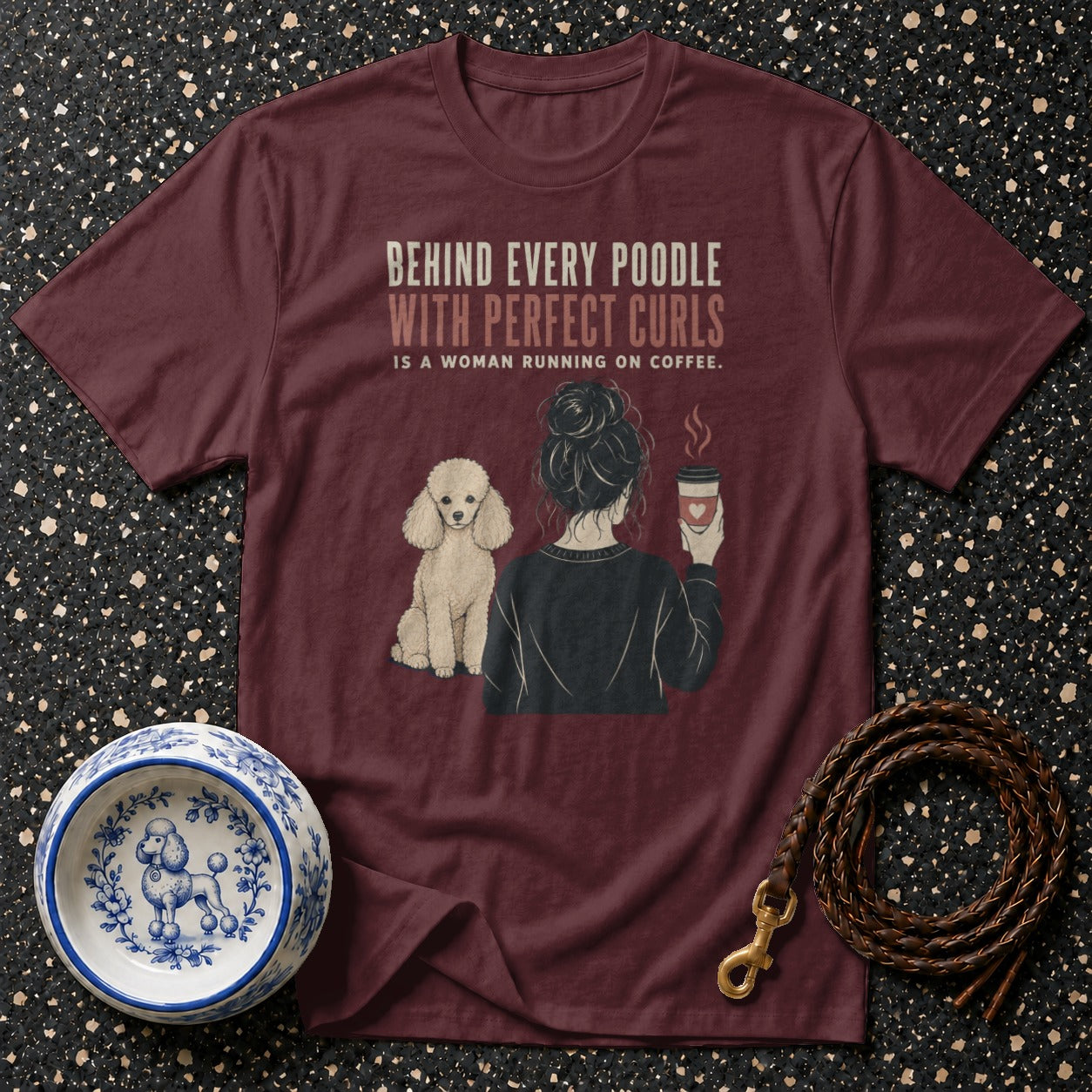 Maroon t-shirt with poodle and woman holding coffee, text says "Behind Every Poodle".