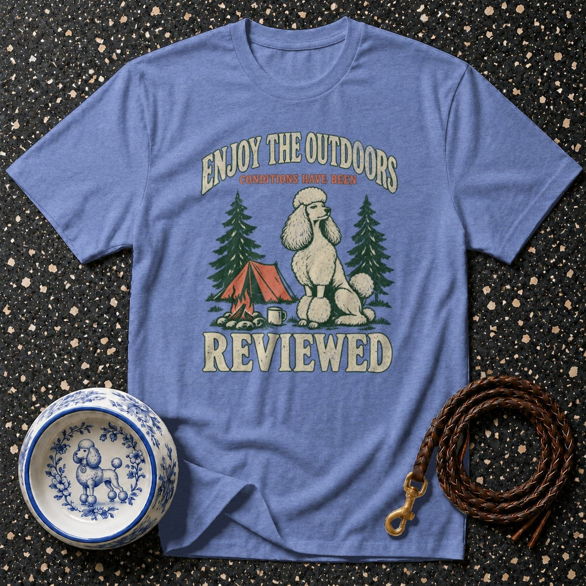 Blue t-shirt with poodle camping graphic and text "Enjoy the Outdoors Reviewed".