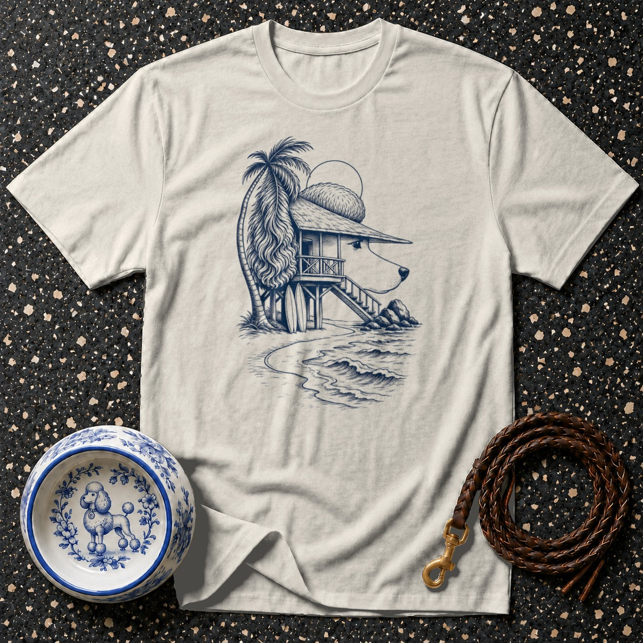 T-shirt with a line drawing of a dog-shaped beach house and a poodle dog bowl.