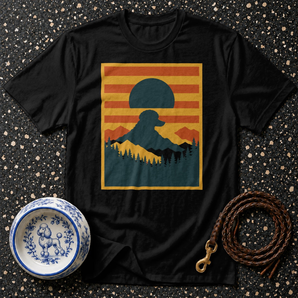 Black t-shirt with mountain landscape featuring a dog silhouette at sunset.