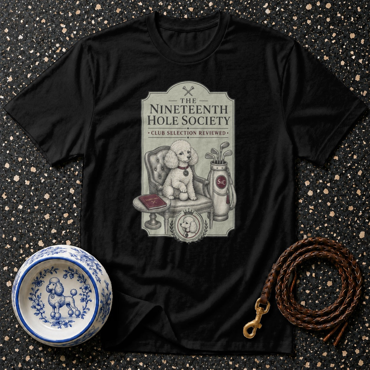 Black t-shirt with "The Nineteenth Hole Society" golf dog graphic.