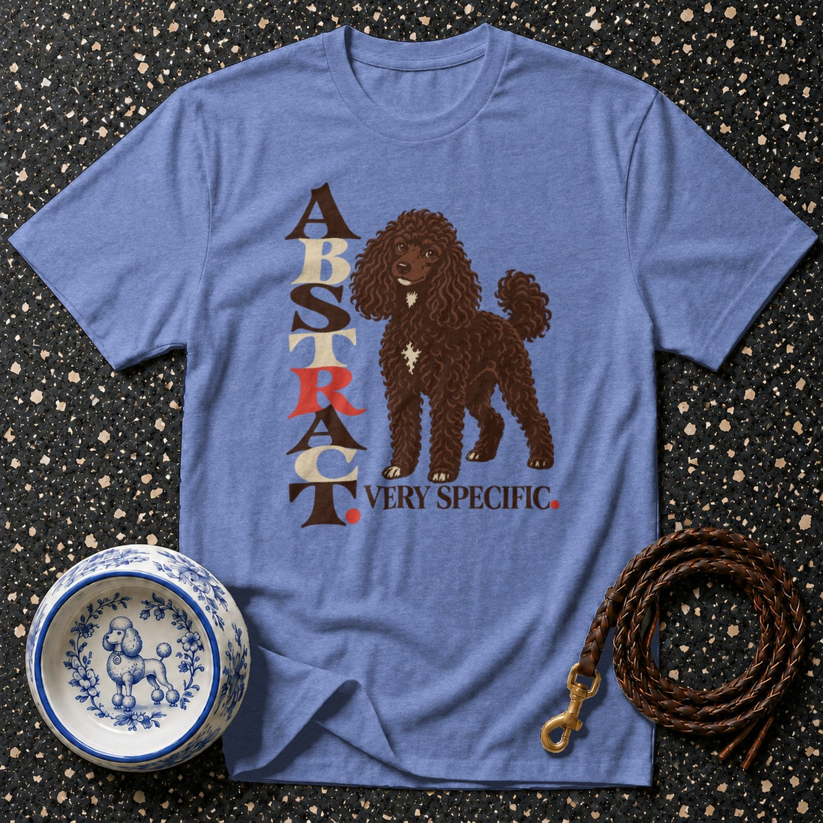 Blue t-shirt with a brown poodle graphic and text "ABSTRACT VERY SPECIFIC".