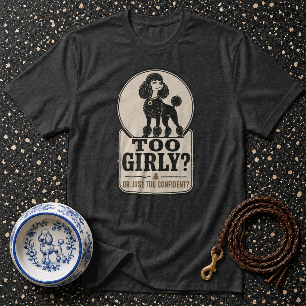 Dark t-shirt with a poodle graphic and text "TOO GIRLY? OR JUST TOO CONFIDENT?".