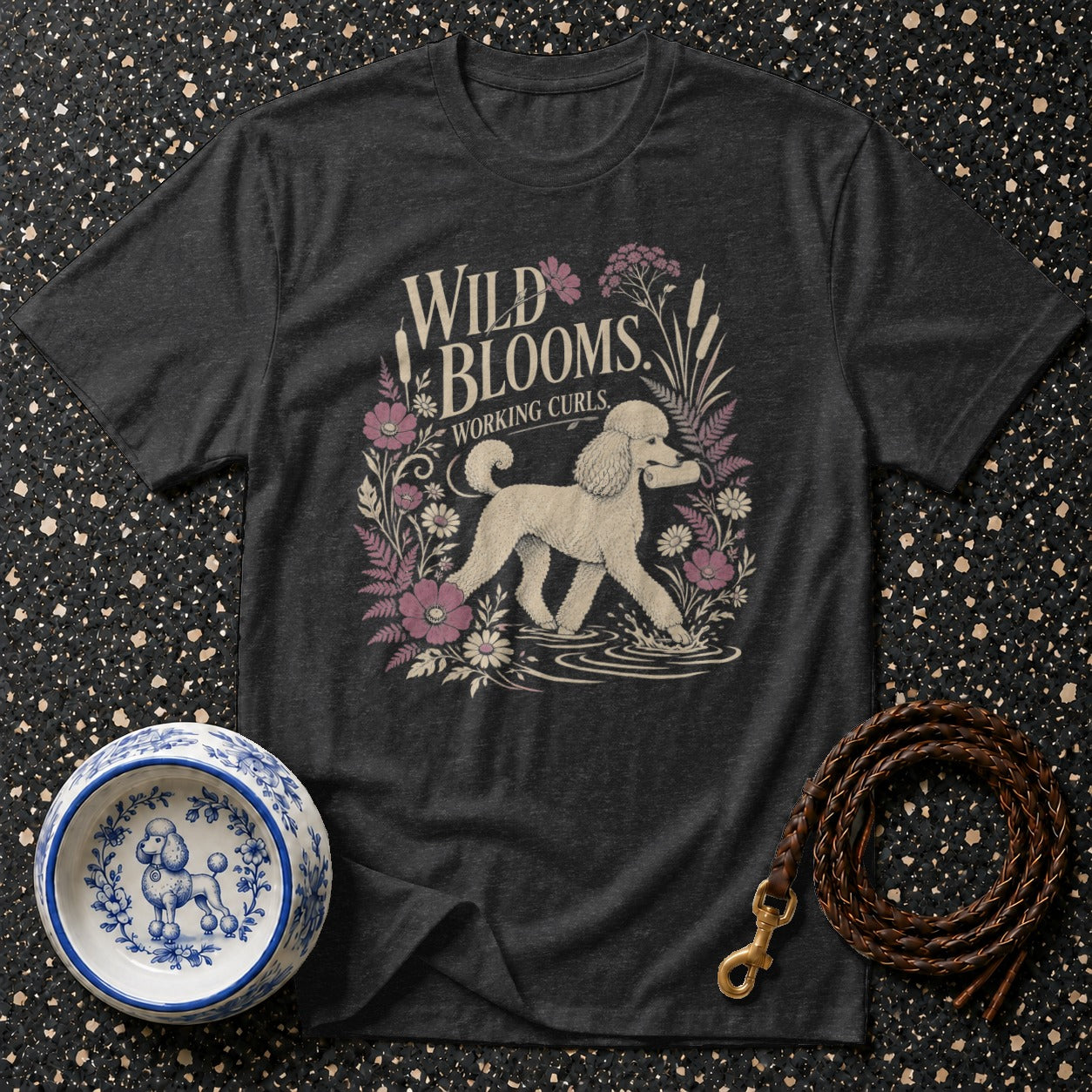 Dark t-shirt with "WILD BLOOMS WORKING CURLS" and a poodle illustration.