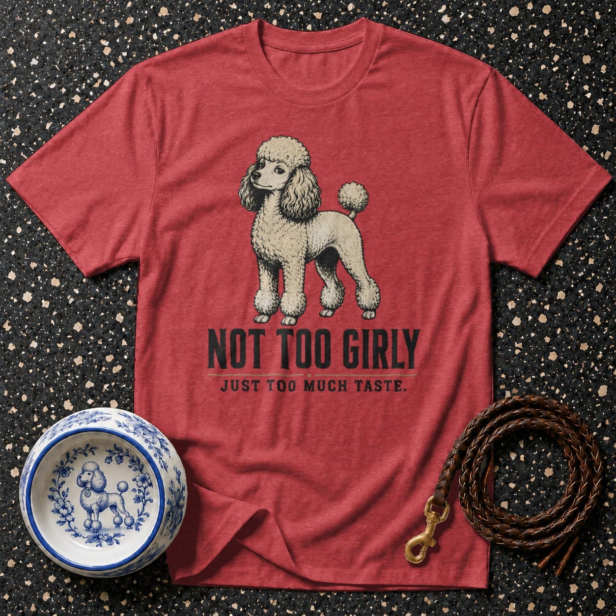 Red t-shirt with a cream poodle graphic and text "Not Too Girly Just Too Much Taste".
