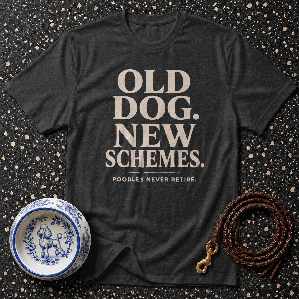 Dark grey t-shirt with text "Old Dog. New Schemes. Poodles Never Retire."