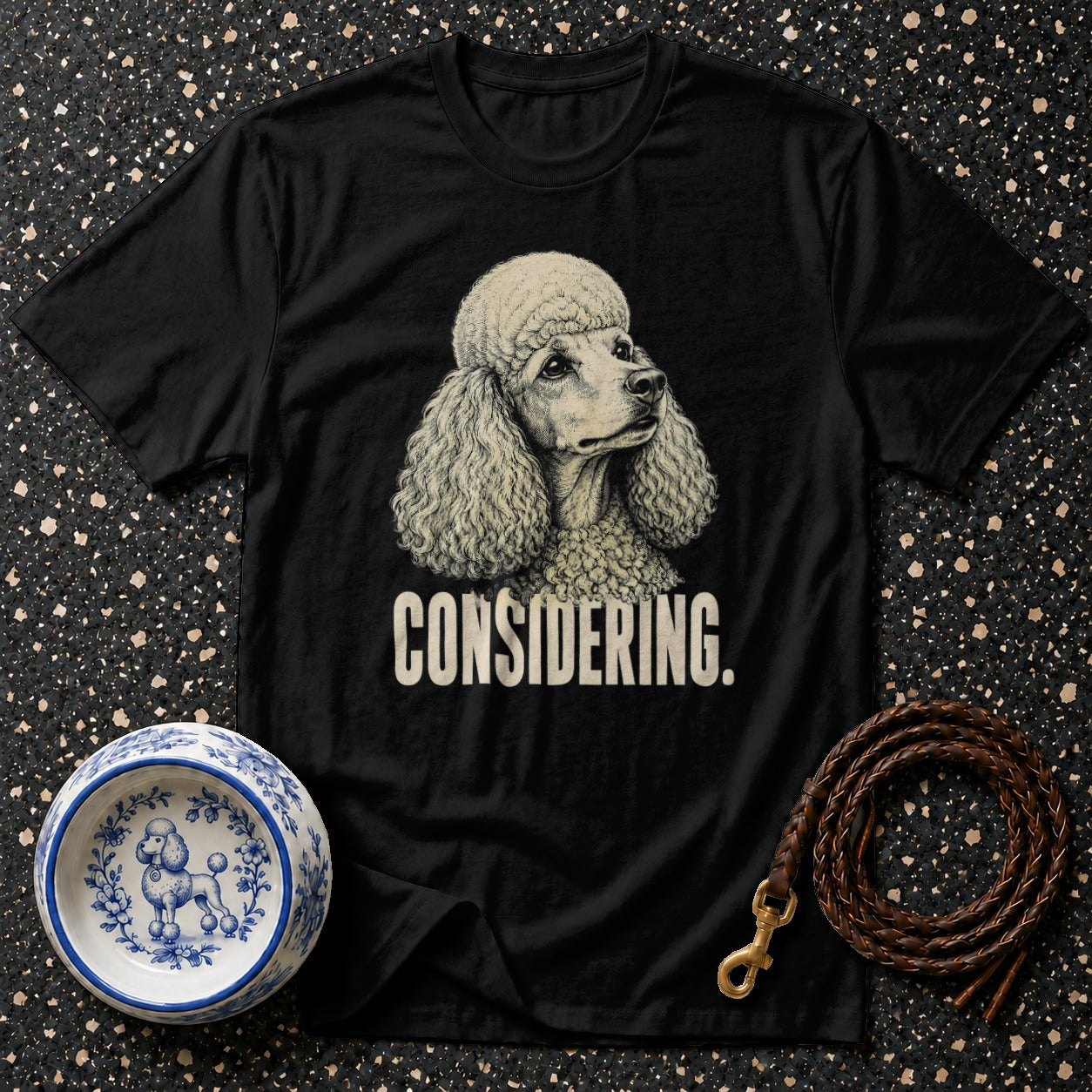 Black t-shirt with poodle illustration and "CONSIDERING." text.