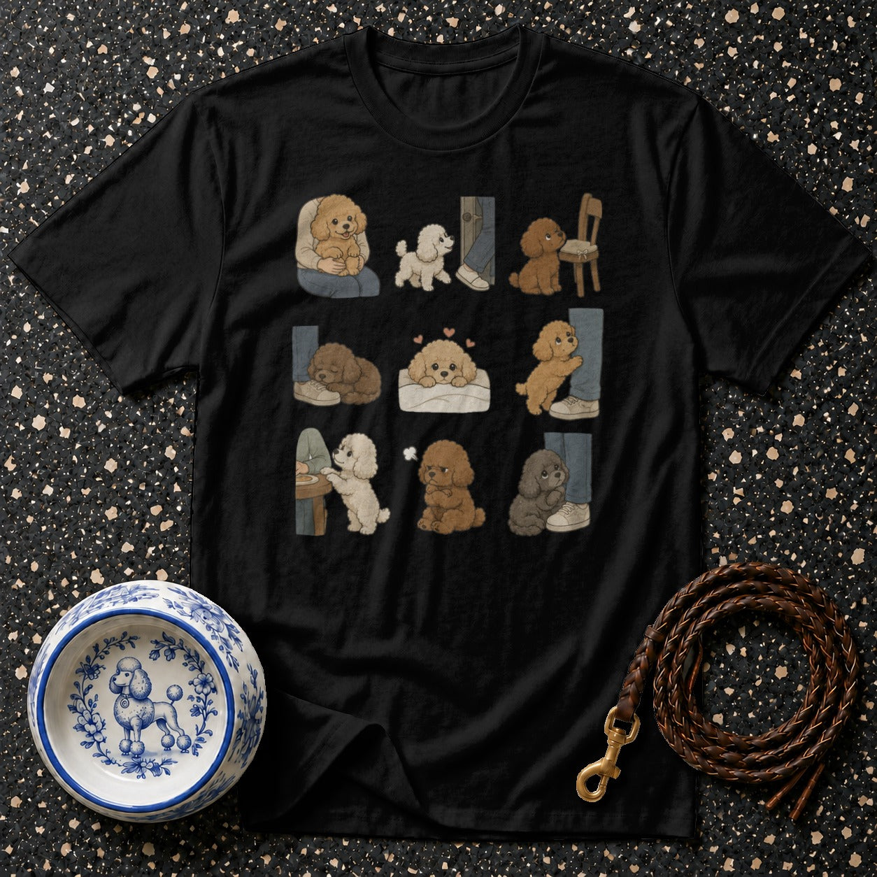 Black t-shirt featuring nine illustrated poodle vignettes with humans.