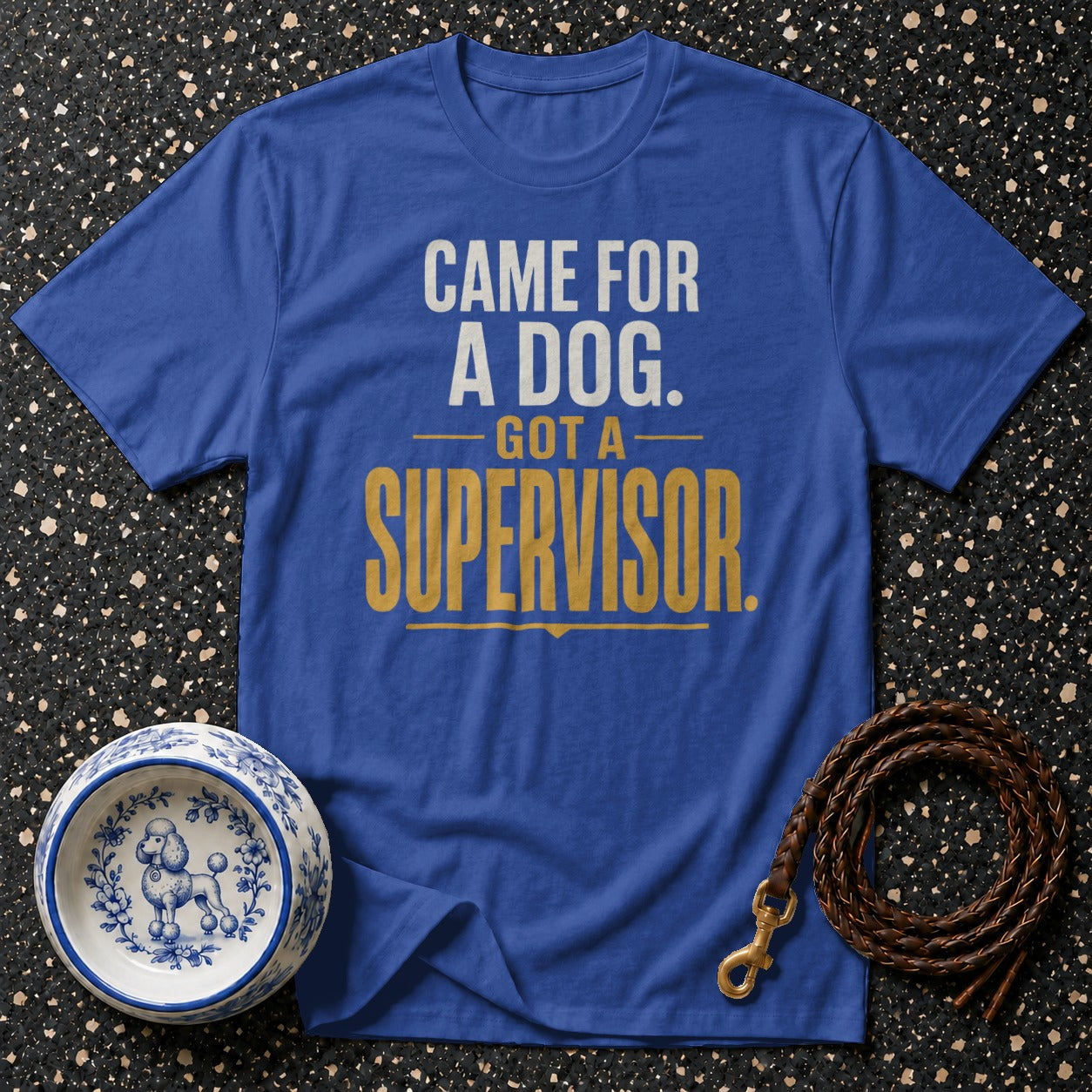 Blue t-shirt with text "CAME FOR A DOG. GOT A SUPERVISOR." and dog bowl.