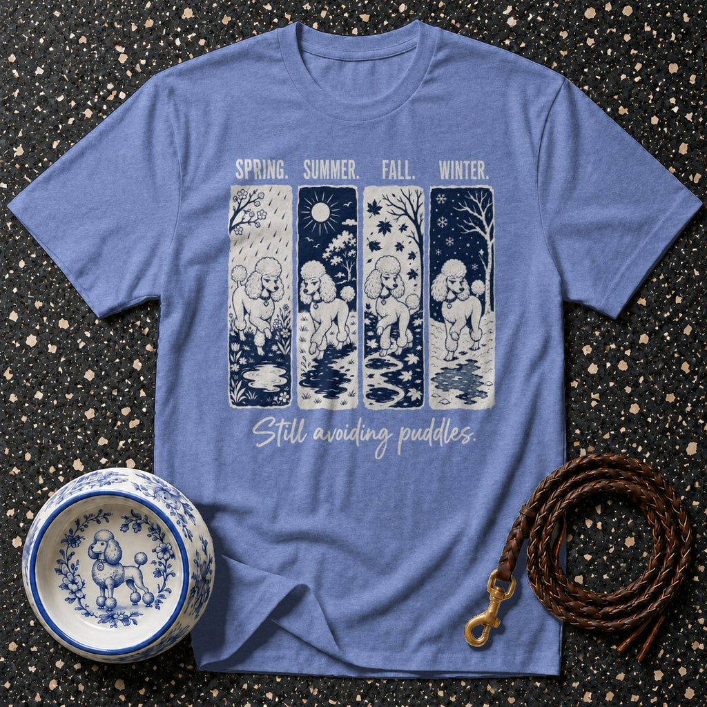 Blue t-shirt with four panels depicting poodles in spring, summer, fall, and winter.