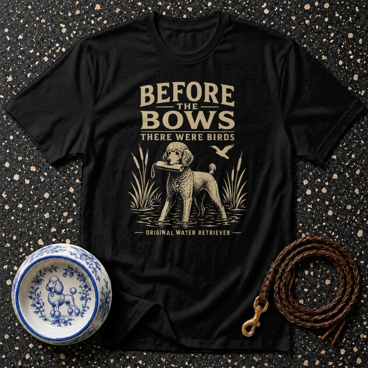 Black t-shirt with poodle graphic and text: "BEFORE THE BOWS THERE WERE BIRDS ORIGINAL WATER RETRIEVER".