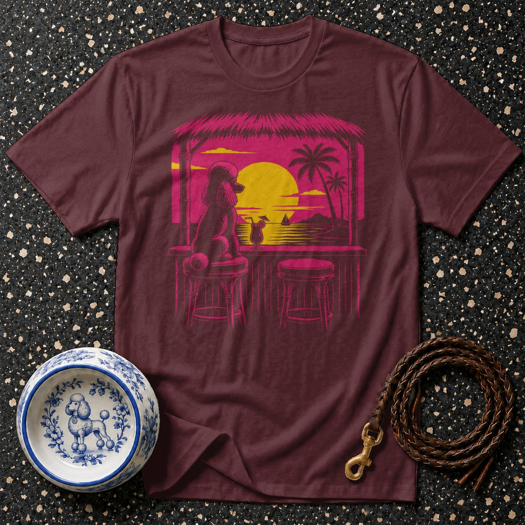 Maroon t-shirt with a poodle at a tropical bar at sunset graphic.