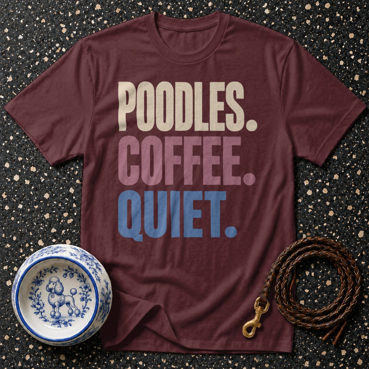 Maroon t-shirt with "Poodles. Coffee. Quiet." text, dog bowl, and leather leash.
