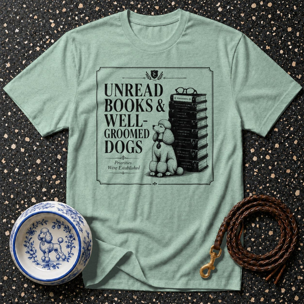 T-shirt with a poodle, stack of books, and text "Unread Books & Well-Groomed Dogs".