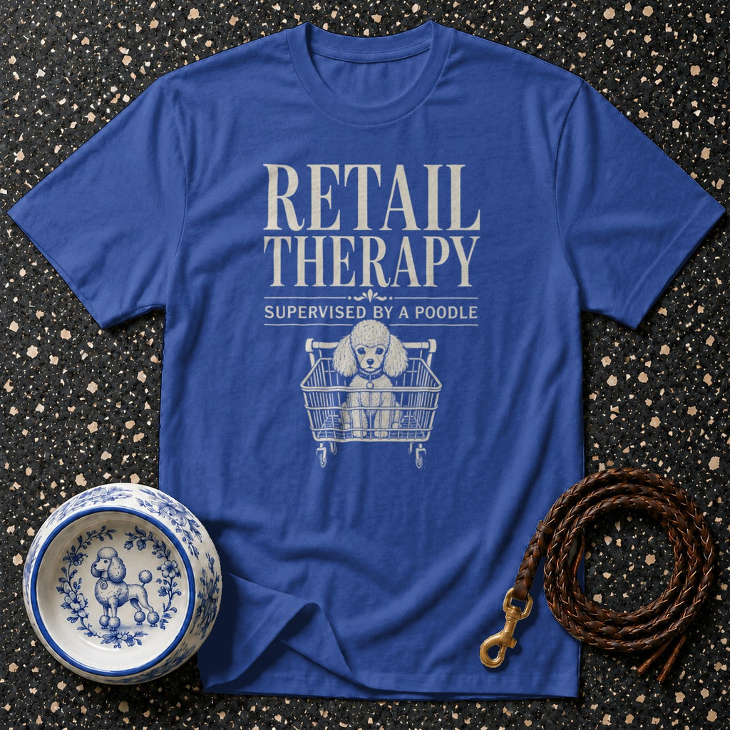 Blue t-shirt with "RETAIL THERAPY SUPERVISED BY A POODLE" text and poodle in shopping cart.