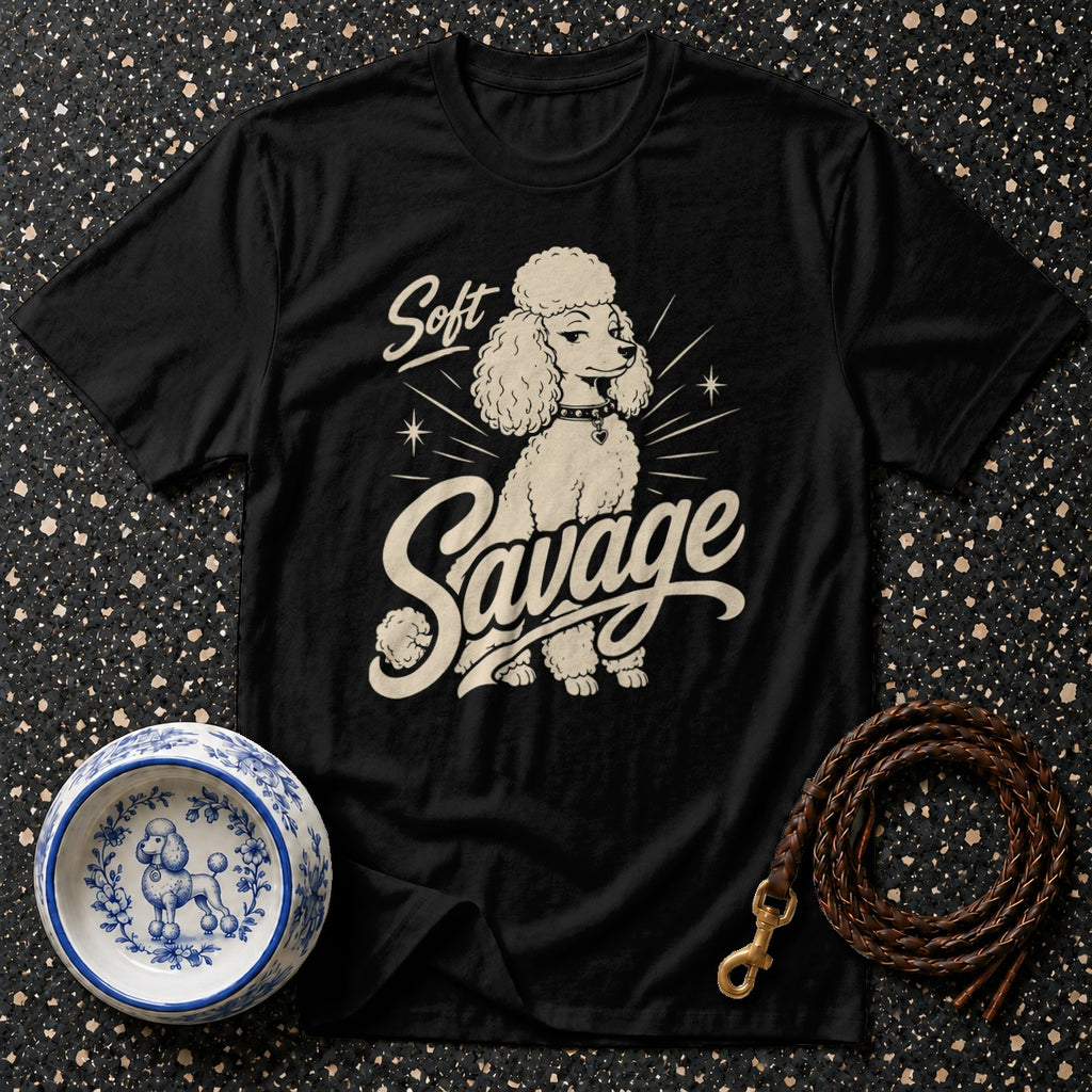 Black t-shirt with a cream graphic of a poodle and the text "Soft Savage".