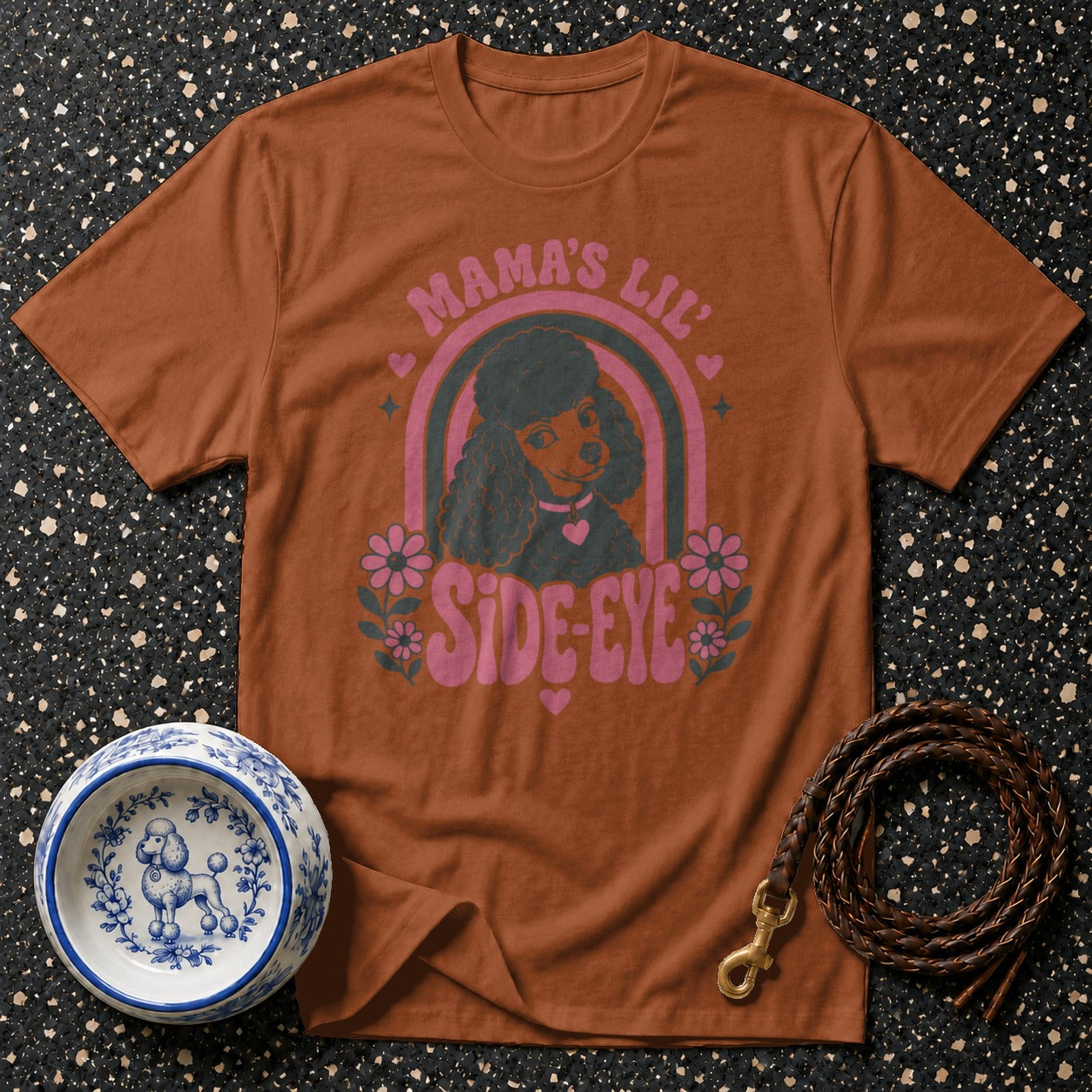 Brown t-shirt with "Mama's Lil Side-Eye" poodle graphic and floral accents.