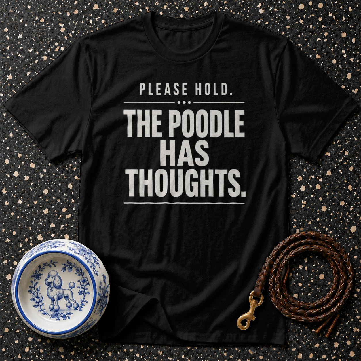Black t-shirt with "PLEASE HOLD. THE POODLE HAS THOUGHTS." text.
