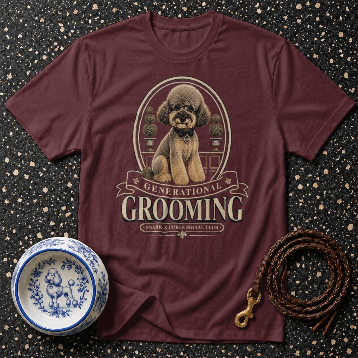 Maroon t-shirt with poodle graphic and text "GENERATIONAL GROOMING SNARK & CURLS SOCIAL CLUB".