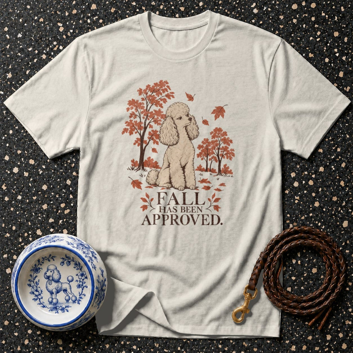 Light grey t-shirt with a tan poodle graphic under fall trees and text.