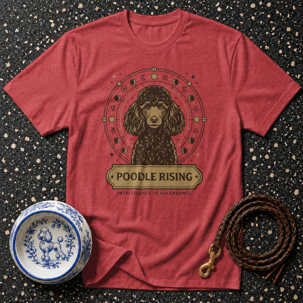 Red t-shirt with a poodle graphic surrounded by celestial symbols and text.
