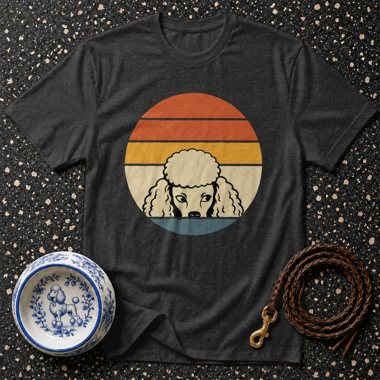 Dark t-shirt with a vintage poodle graphic and a decorative dog bowl.