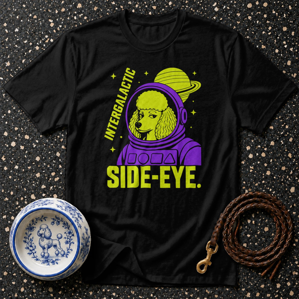 Black t-shirt with a poodle in a purple astronaut suit, text "INTERGALACTIC SIDE-EYE".