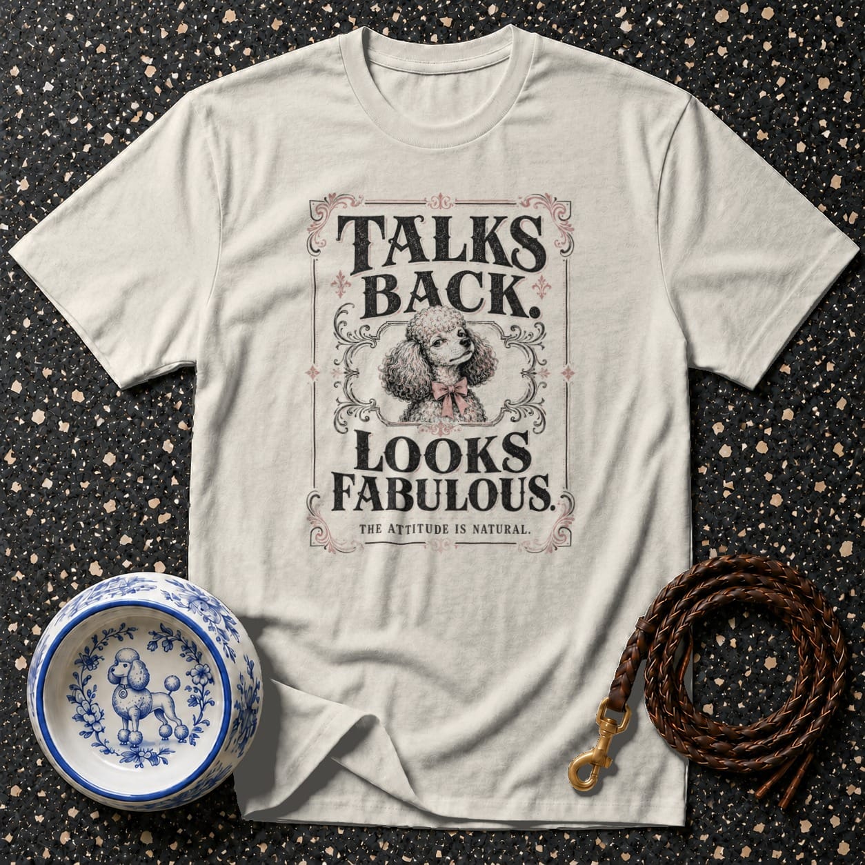 White t-shirt with poodle graphic and text "Talks Back. Looks Fabulous. The Attitude Is Natural."