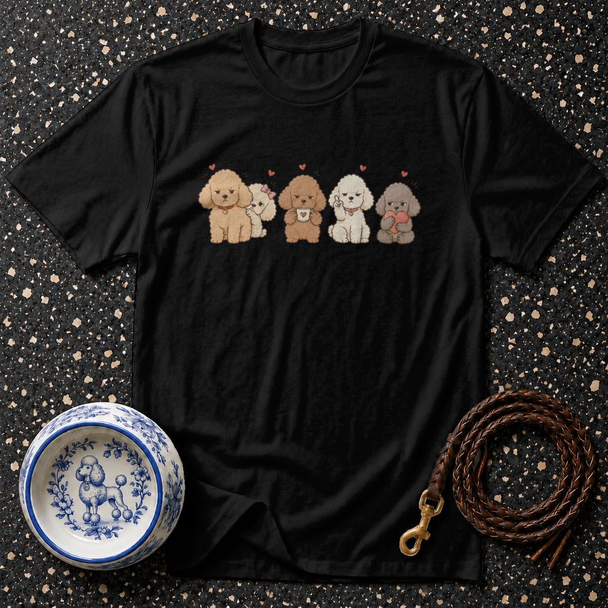 Black t-shirt with five cartoon poodles of different colors and poses.