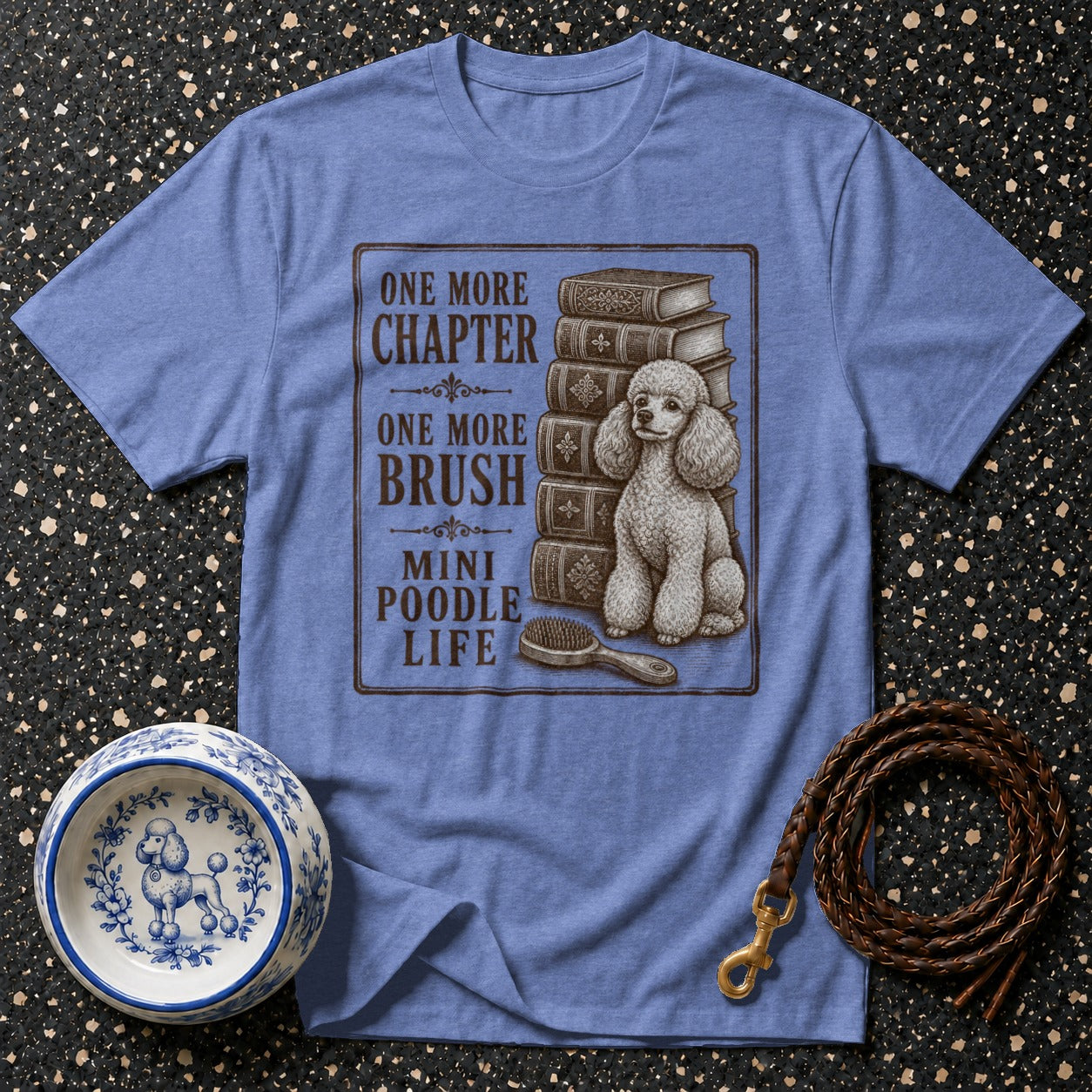 T-shirt with illustration and text: "One More Chapter, One More Brush, Mini Poodle Life."