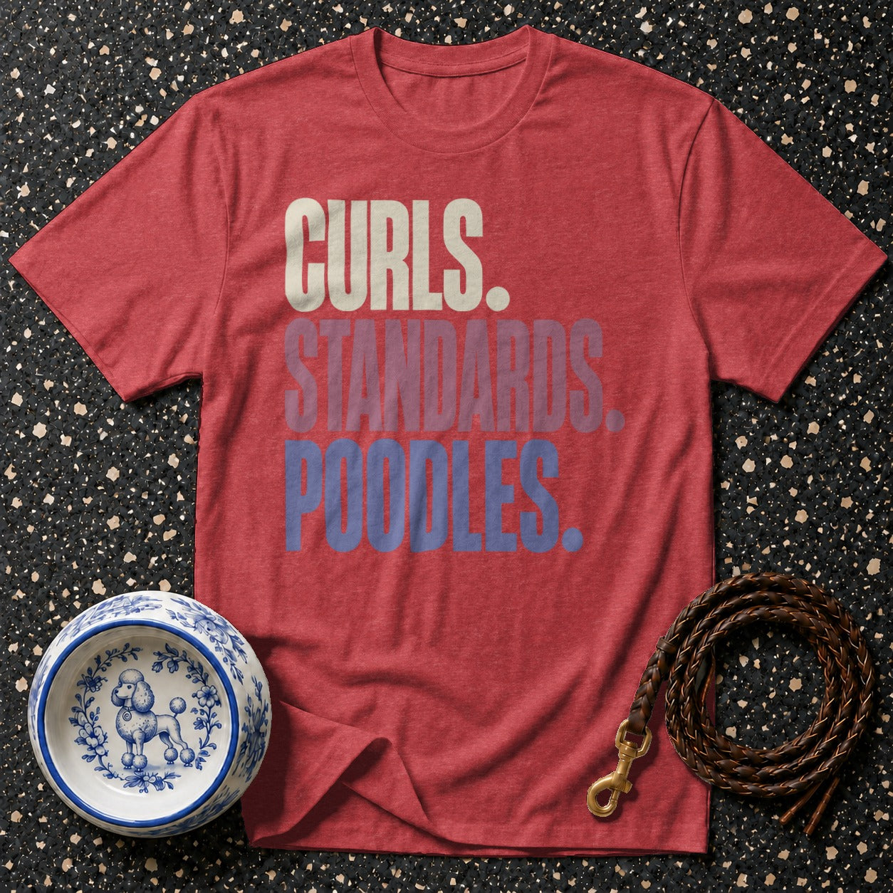 Red t-shirt with "Curls. Standards. Poodles." text, a dog bowl, and leash.