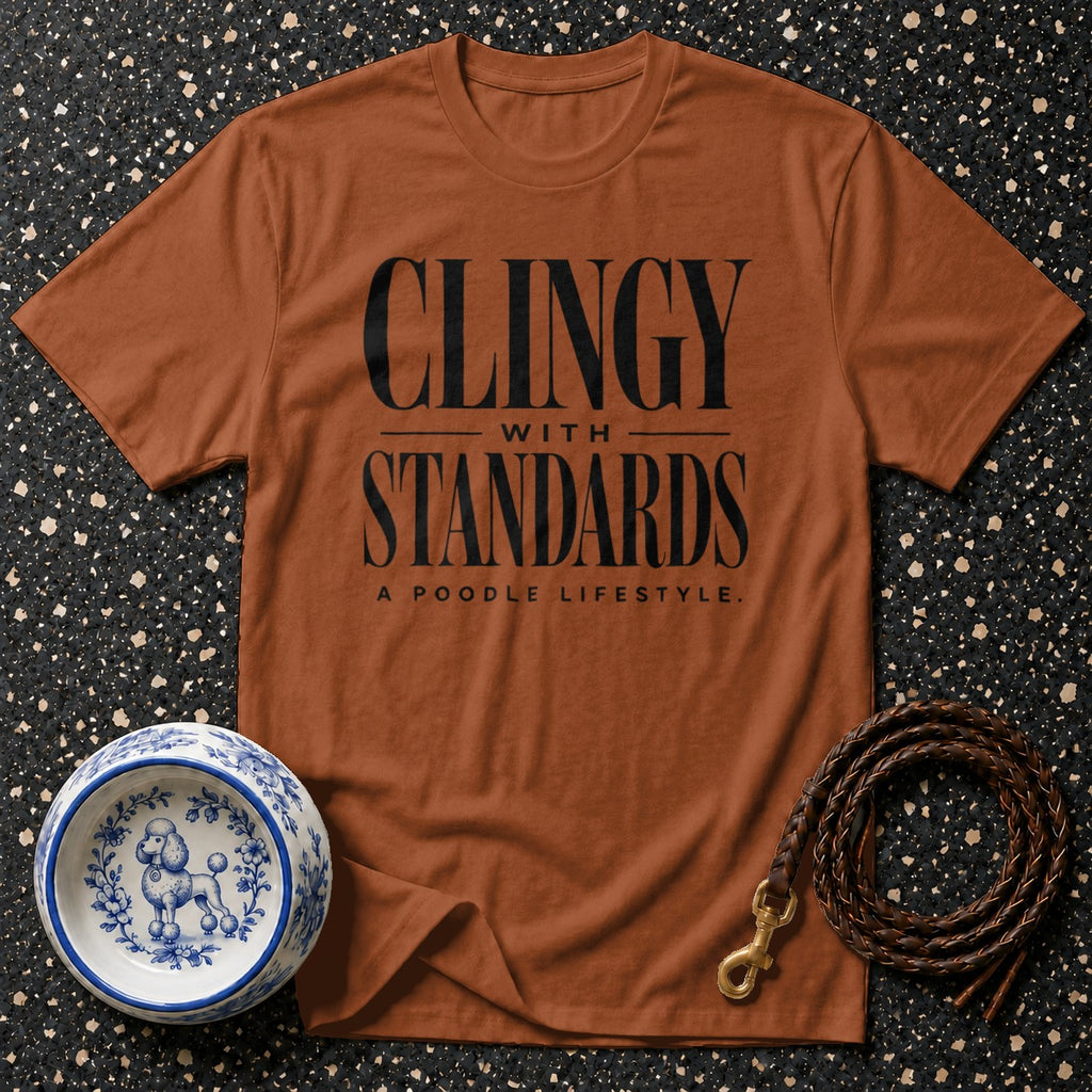 Orange t-shirt with black text "CLINGY WITH STANDARDS A POODLE LIFESTYLE".