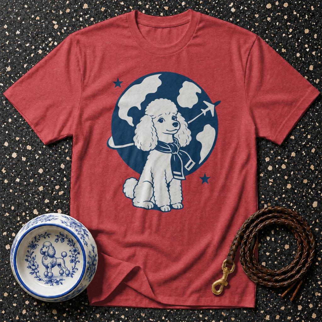 Red t-shirt with a poodle graphic wearing a scarf, globe, and airplane.
