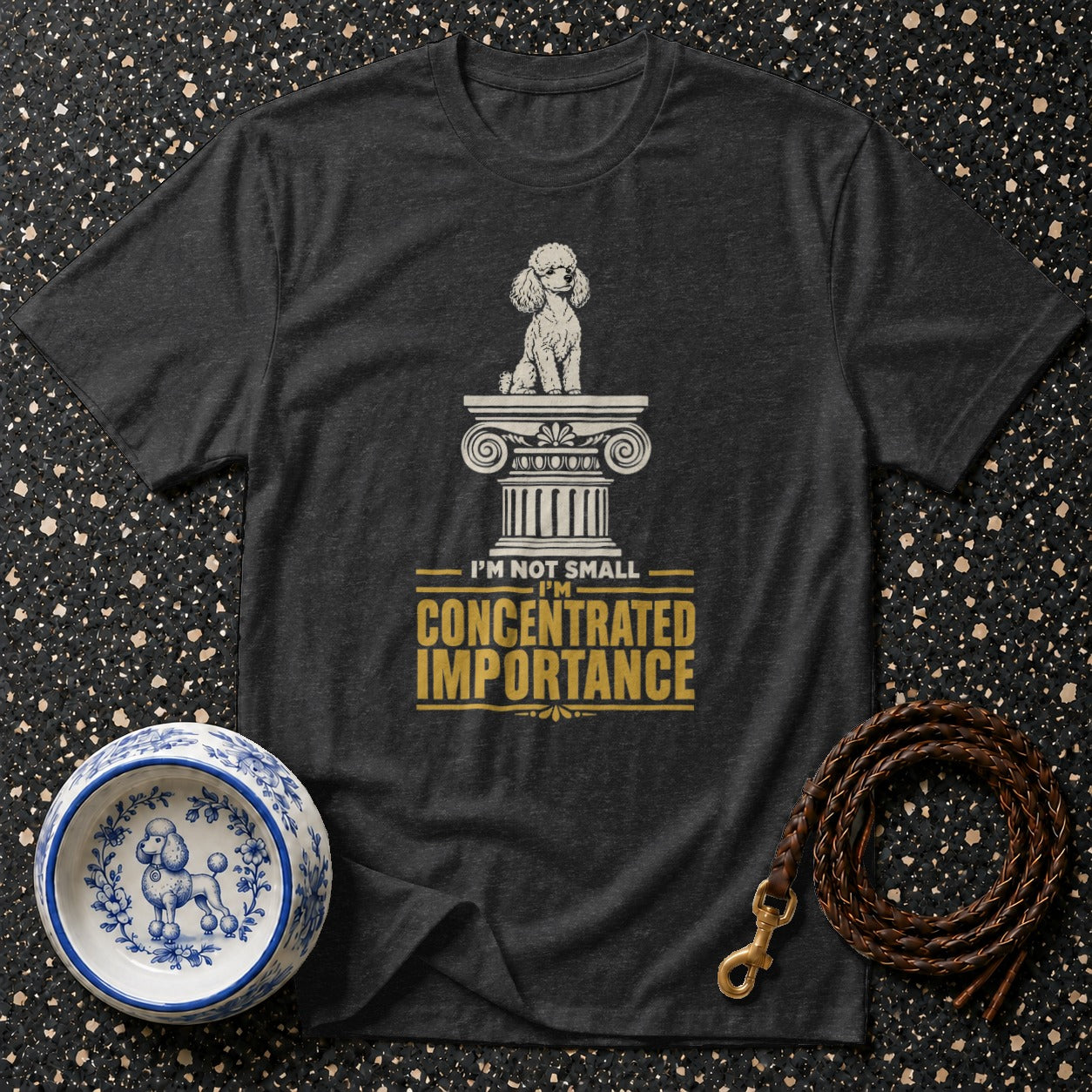 Dark t-shirt with a poodle on a column and "I'm not small, I'm concentrated importance."