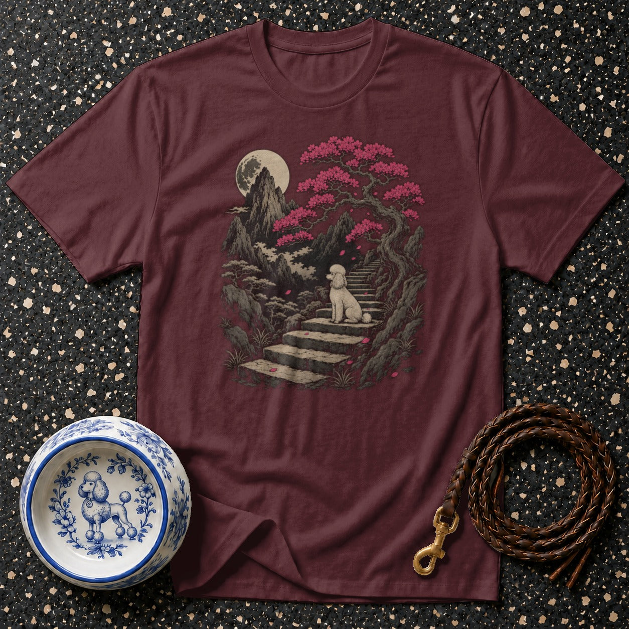 Maroon t-shirt with a white poodle on stairs in a moonlit landscape with cherry blossoms.