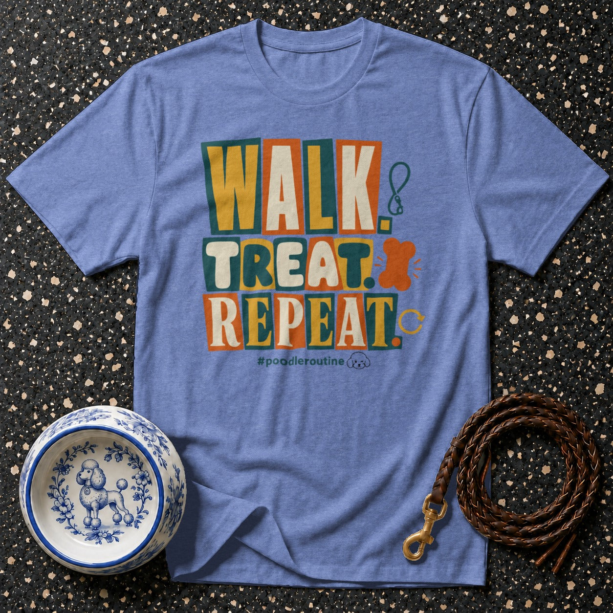 Blue t-shirt with "WALK. TREAT. REPEAT." text and dog-themed graphics.
