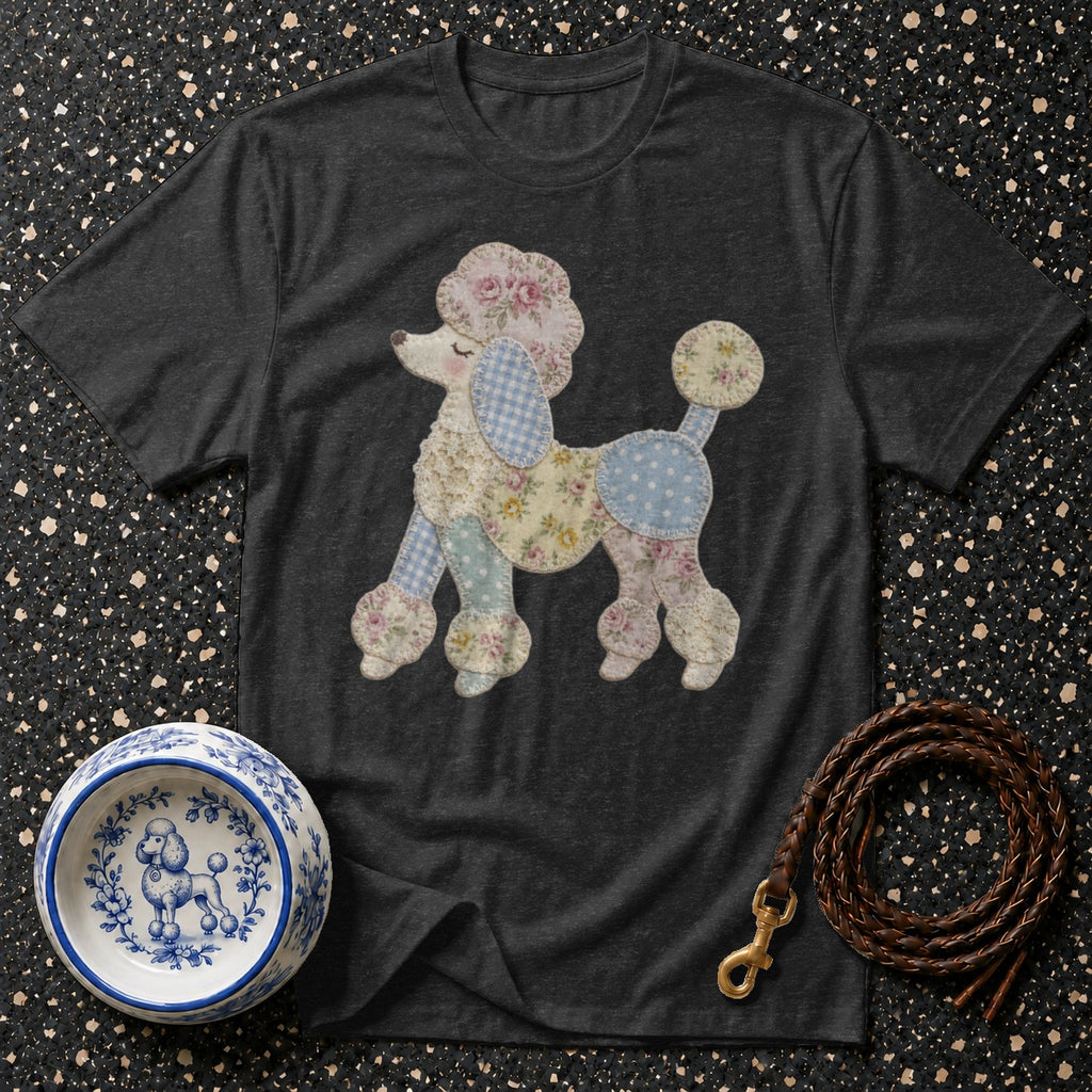 Dark gray t-shirt with a patchwork poodle graphic, blue and white patterned dog bowl, and leather leash.
