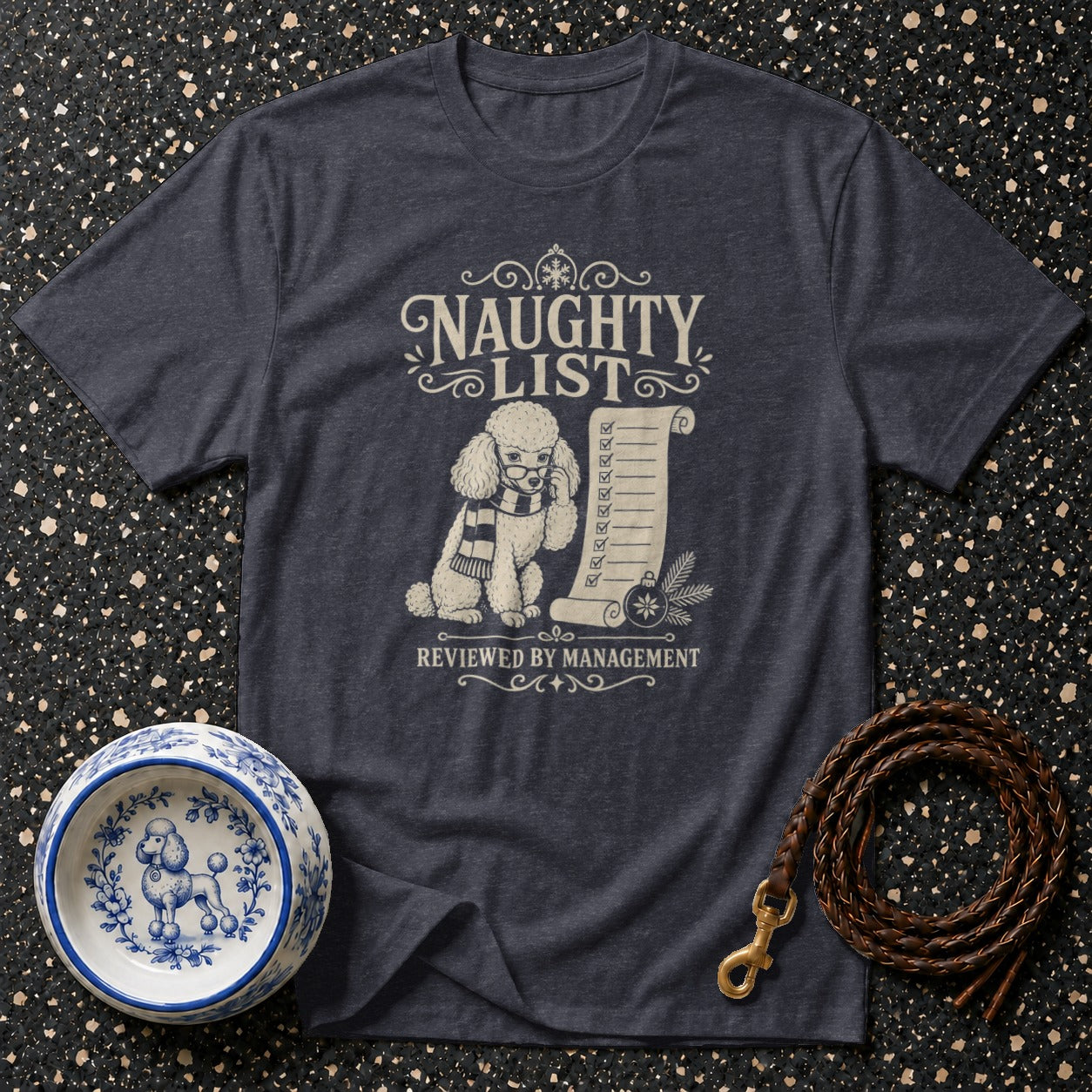 Dark t-shirt with "NAUGHTY LIST REVIEWED BY MANAGEMENT" and poodle graphic.