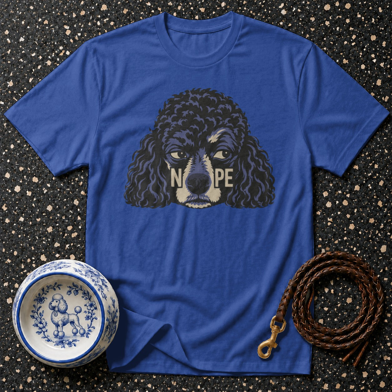 Blue t-shirt with a black poodle graphic and the word "NOPE".