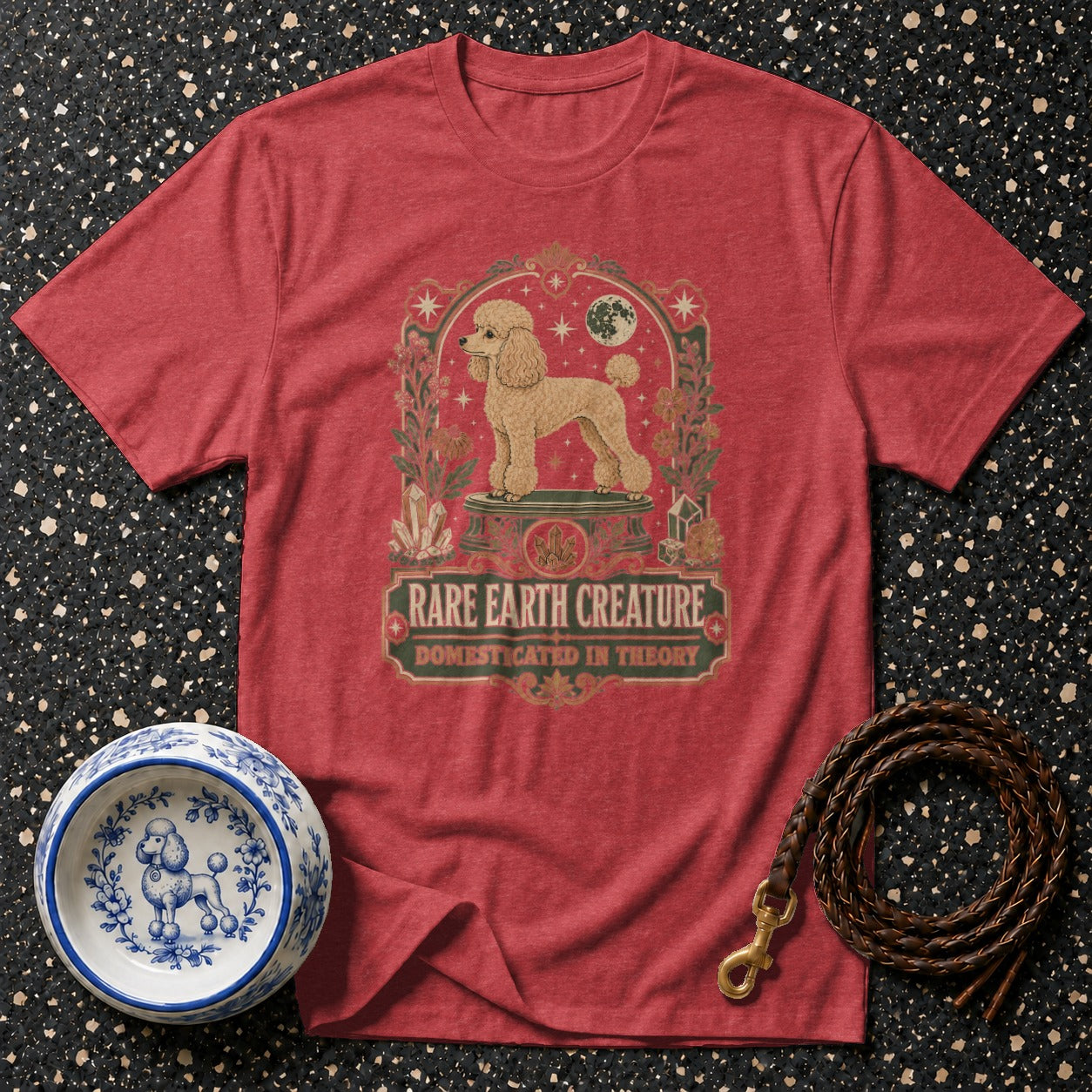 Red t-shirt with a poodle graphic and text reading "Rare Earth Creature".