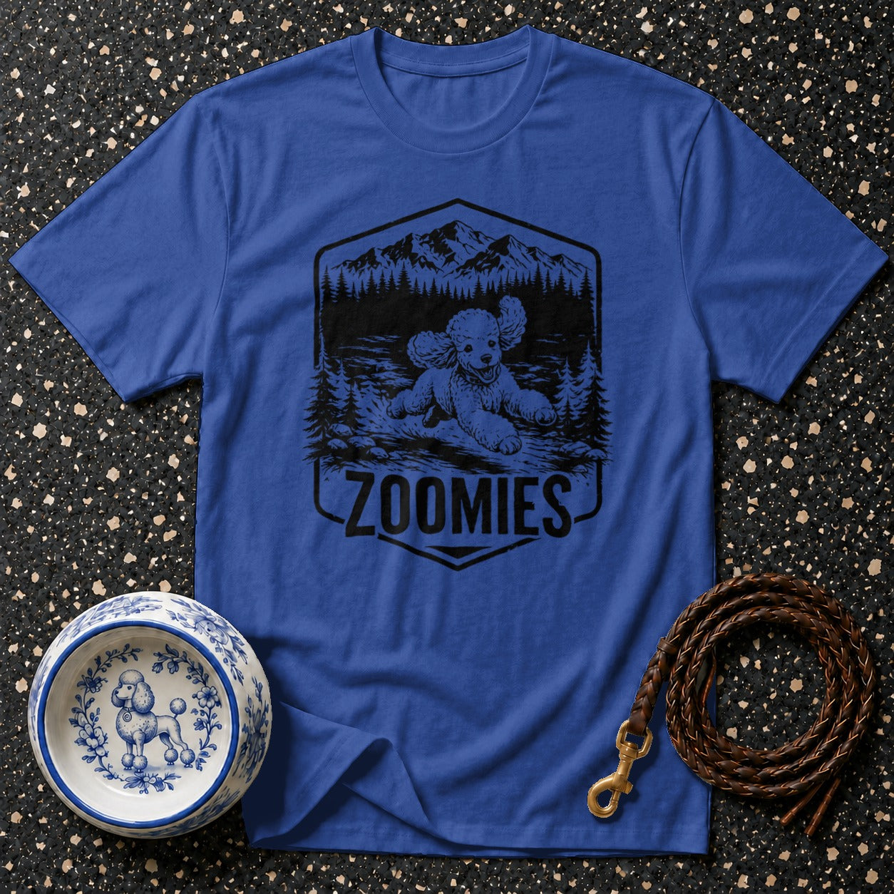 Blue t-shirt with black poodle, forest, and mountain graphic and "Zoomies" text.