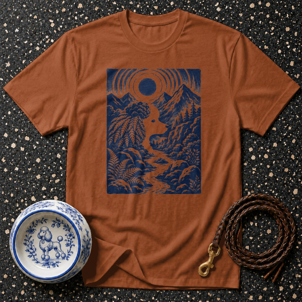 Brown t-shirt with blue mountain landscape and poodle silhouette graphic.