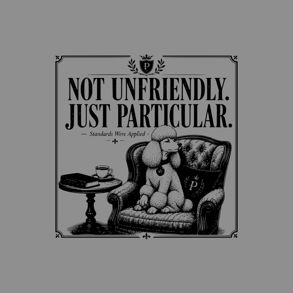 Poodle sitting in armchair with text "NOT UNFRIENDLY. JUST PARTICULAR."