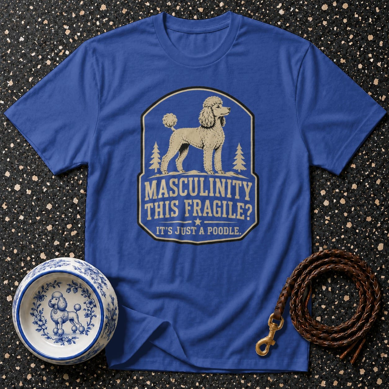 Blue t-shirt with poodle graphic and text: Masculinity This Fragile? It's Just A Poodle.