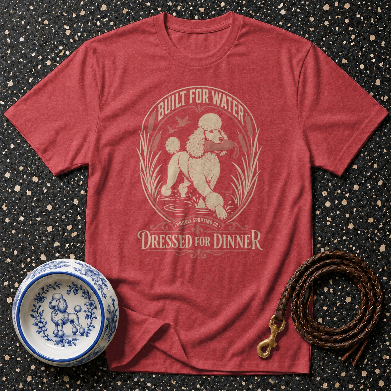 Red t-shirt with poodle graphic: "Built for Water, Dressed for Dinner."