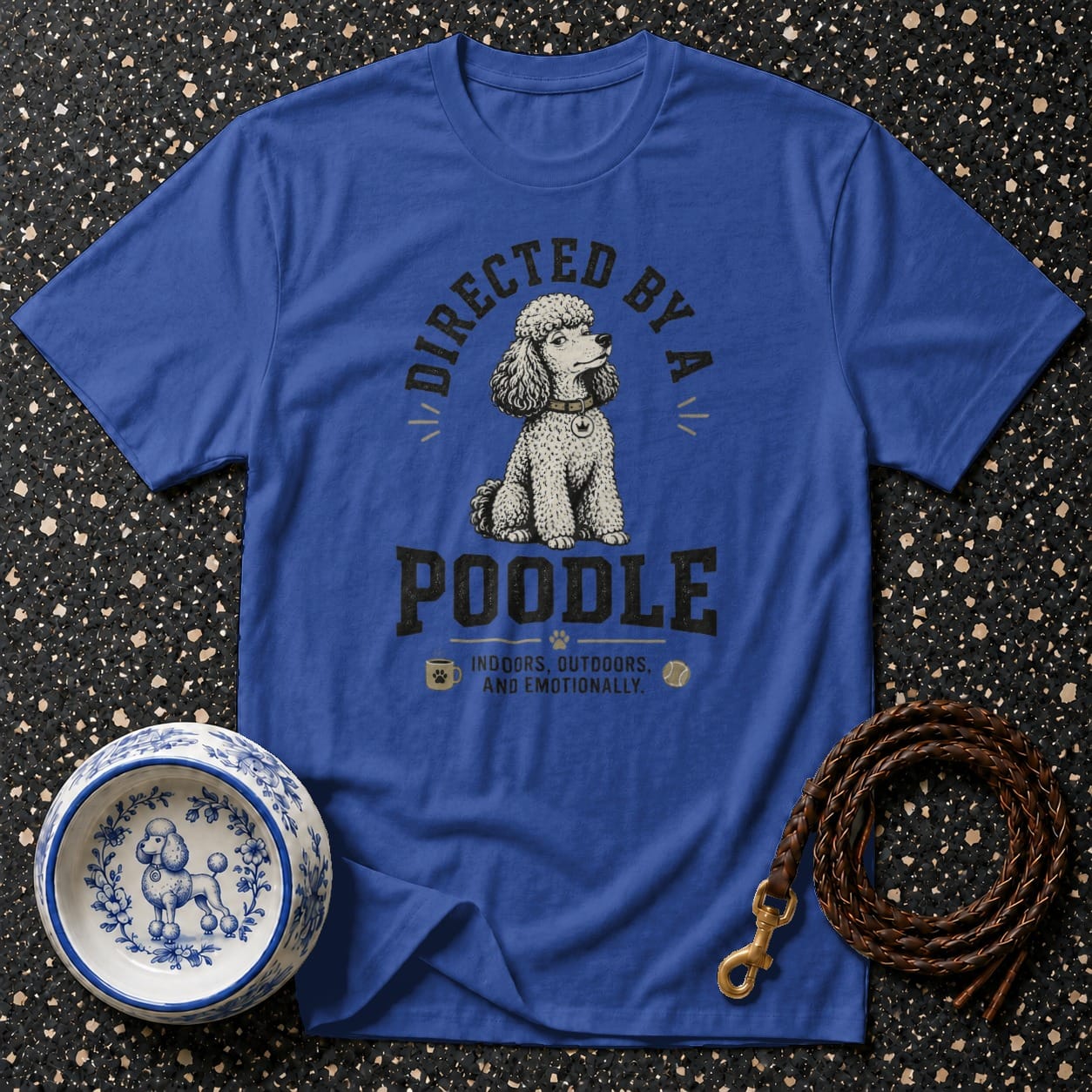 Blue t-shirt with "Directed by a Poodle" text and poodle graphic.