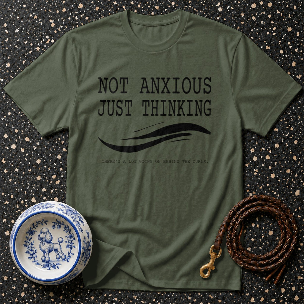 Green t-shirt with "Not Anxious Just Thinking" text and poodle-themed accessories.