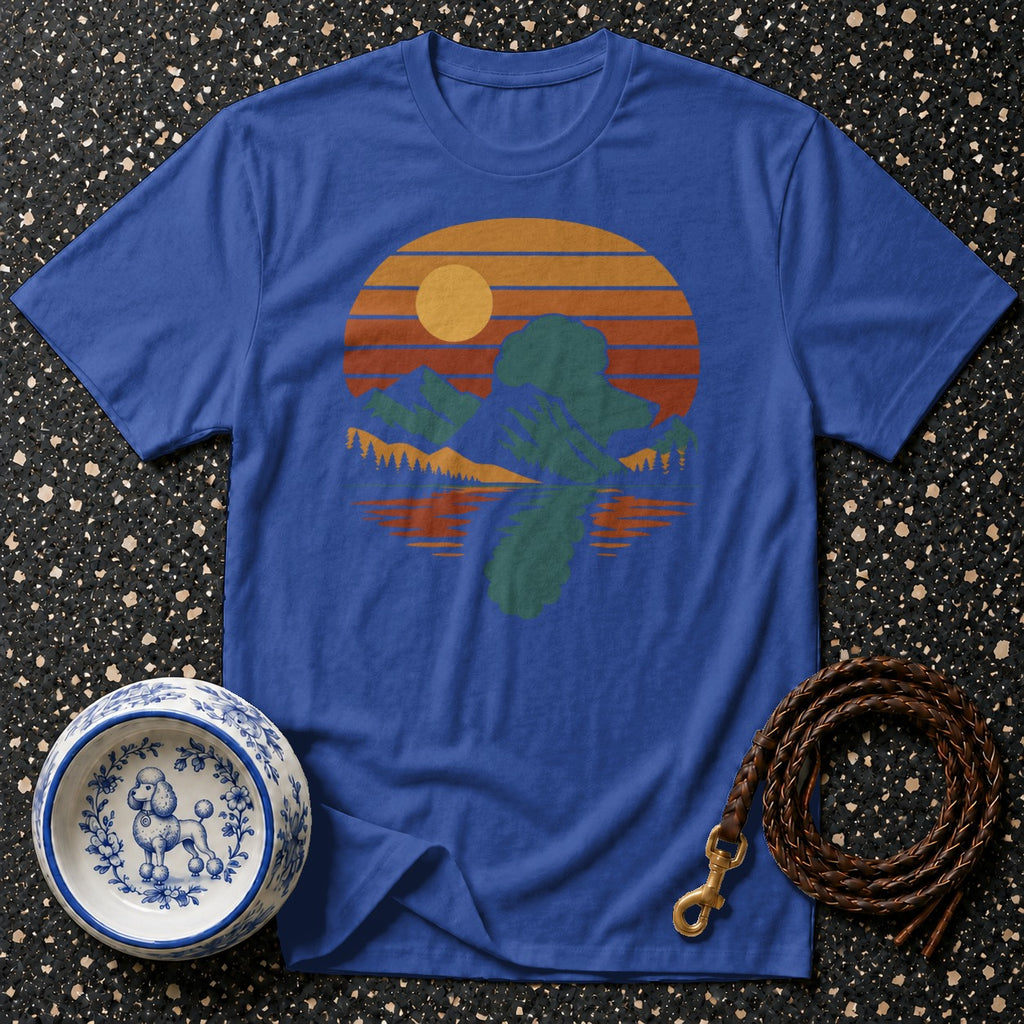 Blue t-shirt with retro sunset mountain reflection design.