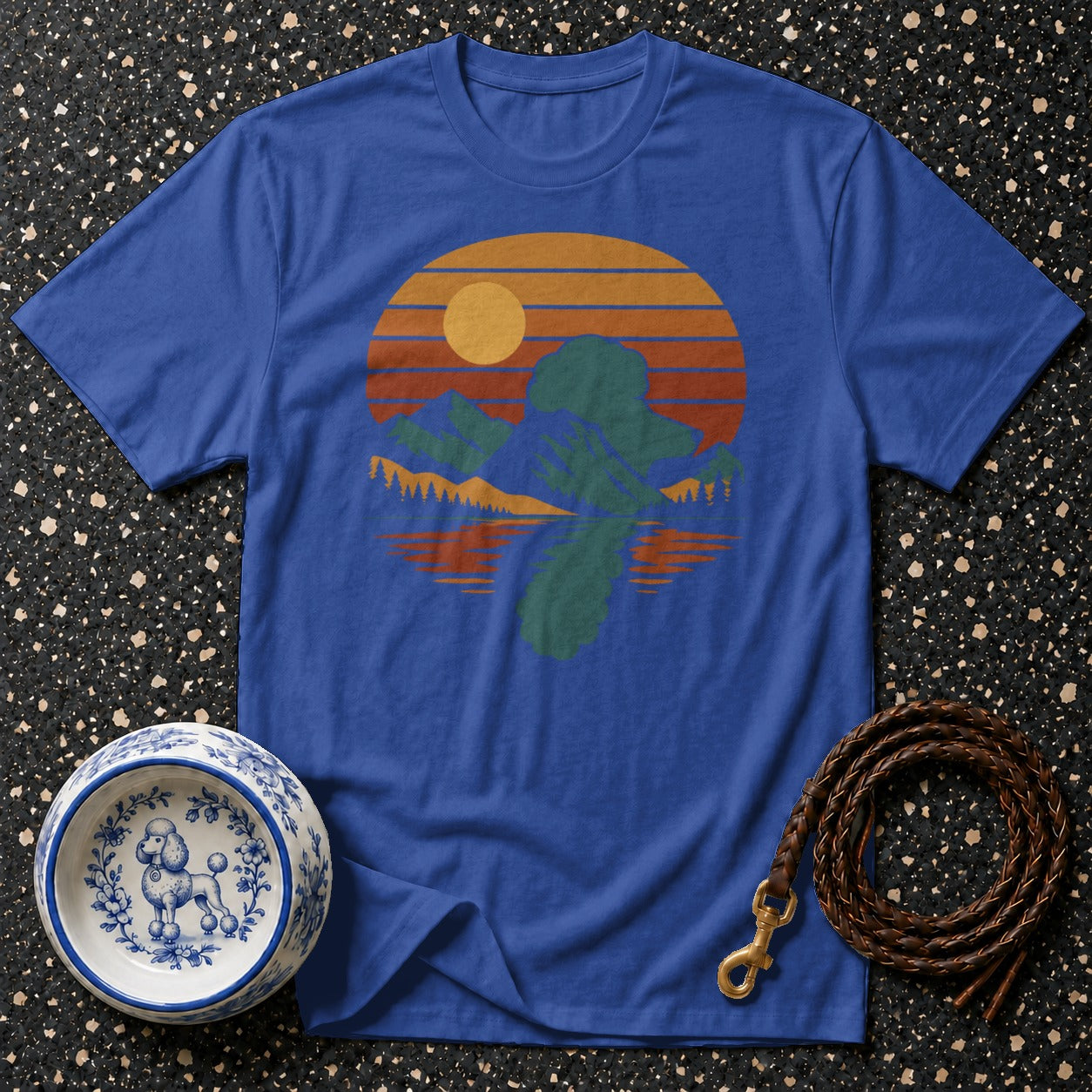Blue t-shirt with retro sunset mountain reflection design.