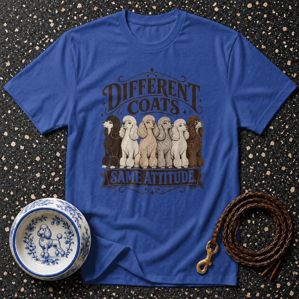 Blue t-shirt with line art of poodles of different colors and text "DIFFERENT COATS SAME ATTITUDE".